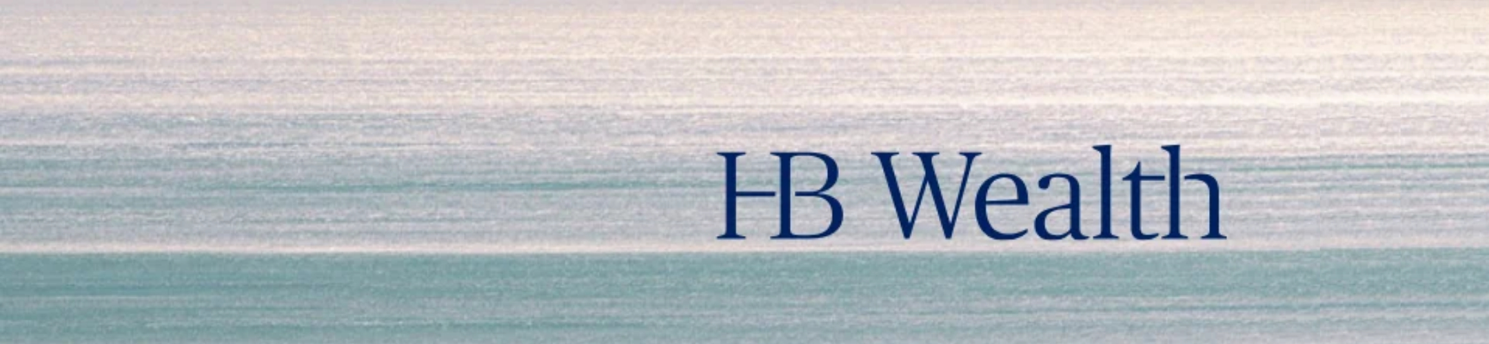 Calm, pastel-hued water with a soft, shimmering surface. The text “FB Wealth” appears in large, dark blue font on the right side of the image.
